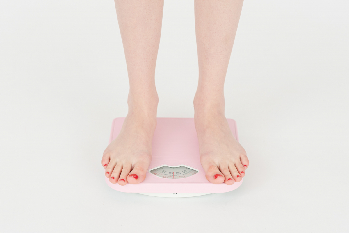 Woman on a weighing scale